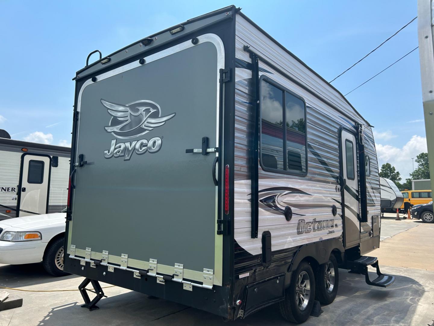 2018 Silver JAYCO OCTANE (1UJBJSBJXJ1) , located at 17760 Hwy 62, Morris, OK, 74445, 35.609104, -95.877060 - 2018 JAYCO OCTANE SUPER LITE 161 TOYHAULER IS 16FT, FEATURES STAINLESS STEEL APPLIANCES, SEAMLESS COUNTERTOPS, SPRING ASSIST REAR RAMP DOOR, SLIDE DOWN SCREEN DOOR, REAR ELECTRIC QUEEN BED WITH ROLLOVER SOFA, TUB/SHOWER COMBO, INTERIOR/EXTERIOR SPEAKERS, OUTSIDE SHOWER, AND AN OUTSIDE FILL UP STATIO - Photo#1